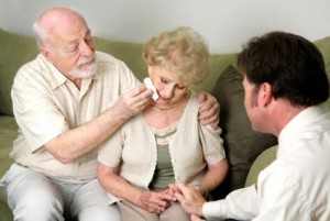 Funeral Director and Grieving Couple